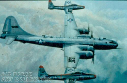 TWO F-84E FIGHTERS COUPLED TO A B-29